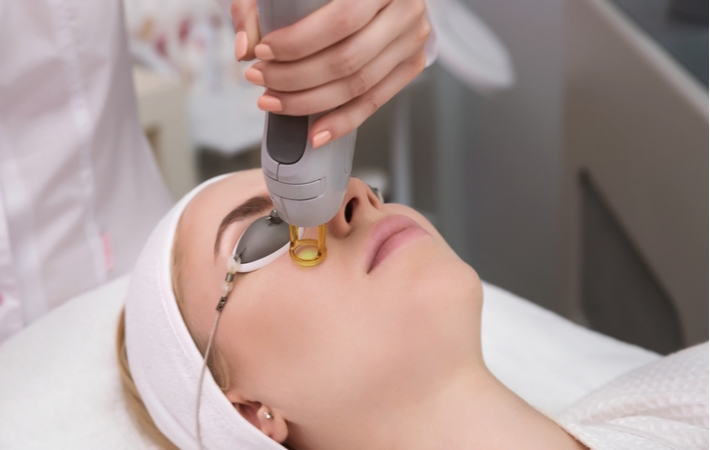 A woman getting an OptiLight treatment for her dry eye disease