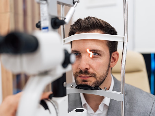 Adult male getting eye exam