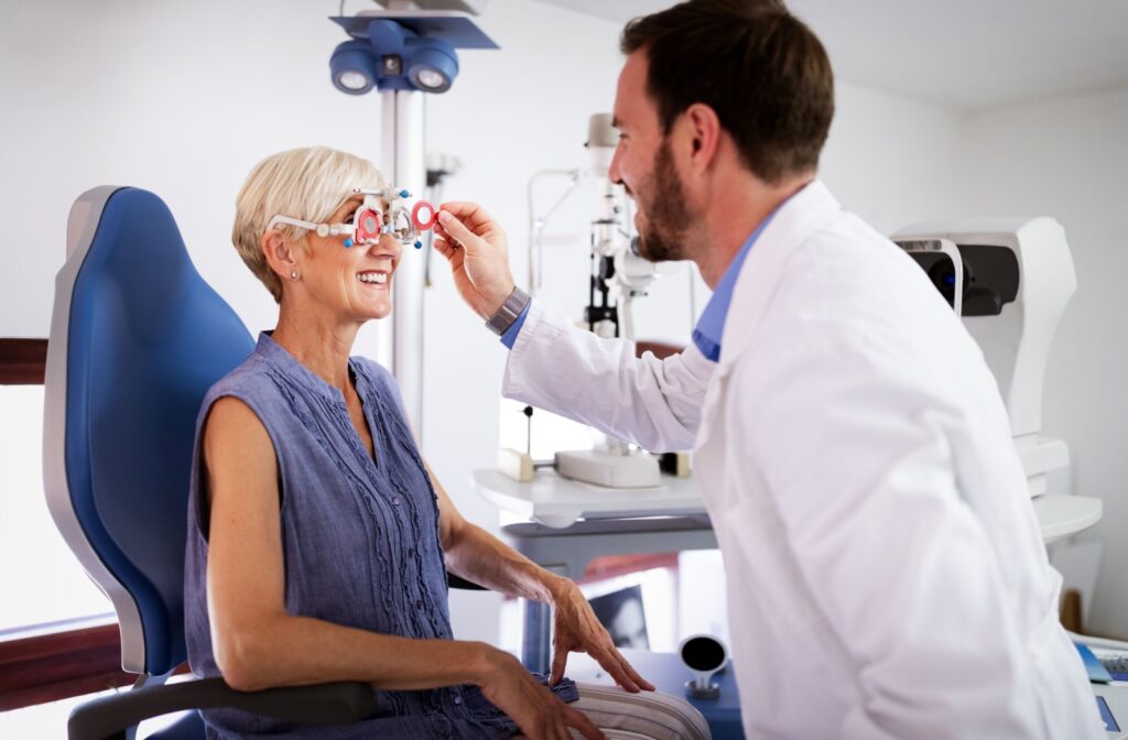 Optometrist assessing eye health and vision clarity for an older patient during a comprehensive exam.