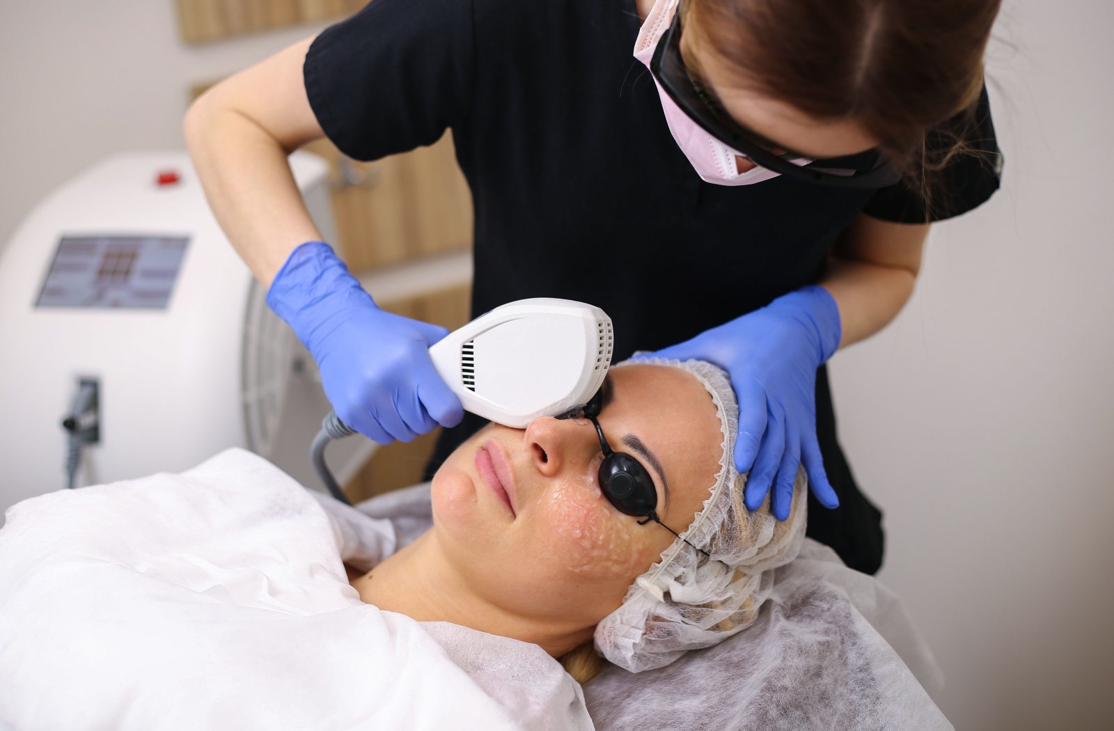 An adult undergoes intense pulsed light therapy.